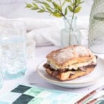a papermoon cheesesteak on a small plate