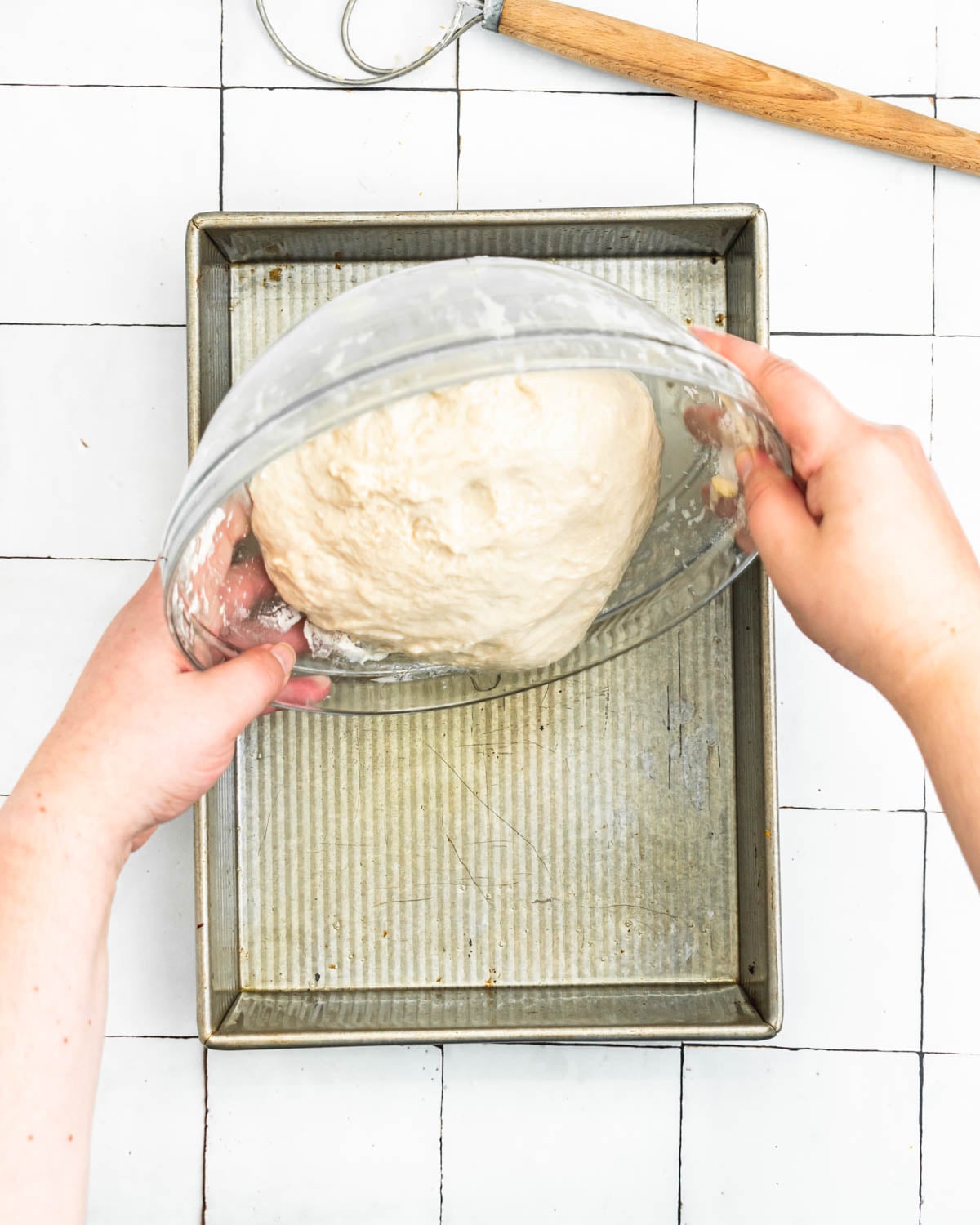 gently tip the focaccia into an oiled baking pan