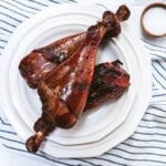 three smoked turkey legs on a plate