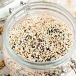 close up of everything bagel seasoning in a glass jar