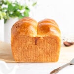 a straight on shot of the end of a loaf of brioche bread.