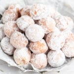close up of powder sugar dusted brioche donut holes