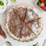 a nutella pizza dusted with powdered sugar and cut into 6 slices.