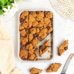 small batch oatmeal chocolate revel bars in an eighth sheet pan cut into diamond shapes.