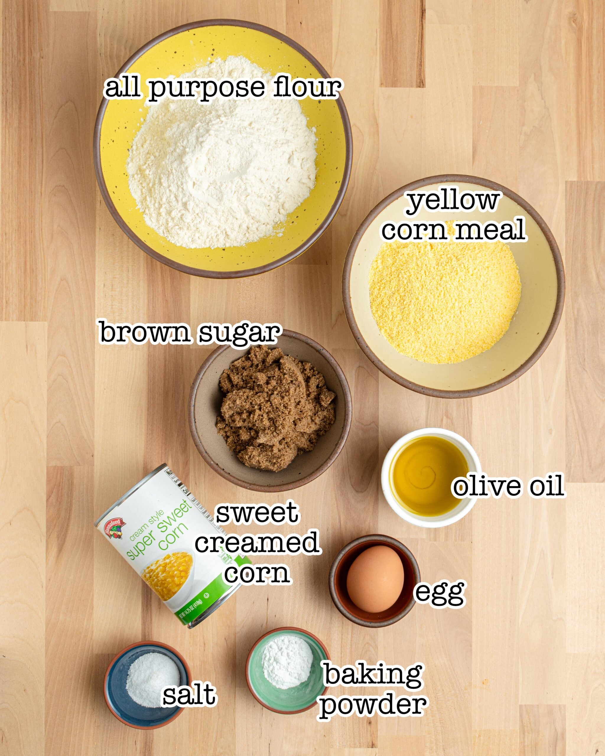 all of the ingredients for skillet cornbread measured out and labeled.