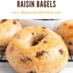 A close-up of a homemade cinnamon raisin bagel and everything bagels on a cooling rack, with other bagels in the background. Text above reads, Homemade Cinnamon Raisin Bagels www.thepracticalkitchen.com.